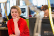 © Chris Ryan/Caia Image - Smiling businesswoman in office