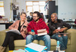 © Chris Ryan/Caia Image - Creative business people using smart phones in office