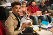 © Chris Ryan/Caia Image - Portrait smiling creative businessman with dog in office