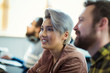 © Robert Daly/Caia Image - Smiling creative businesswoman listening in meeting
