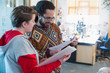 © Chris Ryan/Caia Image - Creative business people discussing paperwork in office