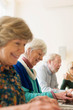 © Martin Barraud/Caia Image - Smiling senior business people in conference room meeting