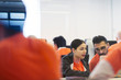 © Sam Edwards/Caia Image - Focused hackers coding for charity at hackathon