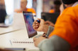 © Sam Edwards/Caia Image - Hacker at laptop coding for charity at hackathon