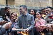 © Martin Barraud/Caia Image - Friends with sparklers celebrating with man holding birthday cake