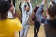 © Sam Edwards/Caia Image - Focused male instructor leading dance class in studio