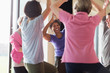 © Martin Barraud/Caia Image - Smiling active senior woman exercising, practicing yoga tree pose