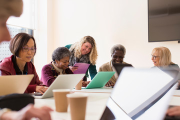 Senior business people in conference room meeting