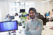 © Sam Edwards/Caia Image - Portrait smiling, confident Indian computer programmer in turban in office
