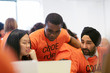 © Sam Edwards/Caia Image - Hackers coding for charity at hackathon