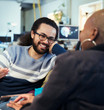 © Robert Daly/Caia Image - Smiling creative business people talking in office