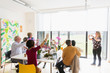 © Tom Merton/Caia Image - Instructor photographing active seniors enjoying flower arranging class