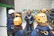 © Trevor Adeline/Caia Image - Zip line students watching instructor