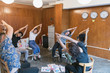 © Tom Merton/Caia Image - Creative business people stretching, taking a break in meeting