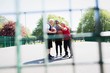 © Tom Merton/Caia Image - Active senior men friends playing basketball in sunny park