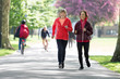 © Robert Daly/Caia Image - Active senior women friends jogging in park