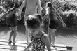 © Sam Edwards/Caia Image - Family playing, jumping into sunny river