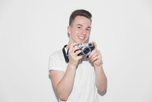 Portrait Smiling, Confident Teenage Boy With Retro Camera