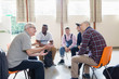 © Tom Merton/Caia Image - Men talking and listening in group therapy