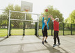 © Robert Daly/Caia Image - Active senior men friends playing basketball in sunny park