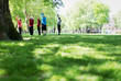 © Tom Merton/Caia Image - Active seniors exercising, practicing yoga in park
