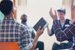 © Tom Merton/Caia Image - Men with bible praying with arms raised in prayer group