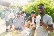 © Tom Merton/Caia Image - Portrait confident young man drinking beer, enjoying barbecue in summer backyard