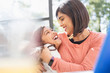 © Tom Merton/Caia Image - Happy, affectionate mother and daughter hugging