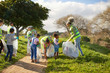 © Trevor Adeline/Caia Image - Volunteers cleaning up litter in sunny park