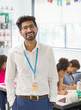 © Robert Daly/Caia Image - Portrait happy male teacher in classroom