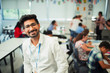 © Paul Bradbury/Caia Image - Portrait smiling, confident male teacher in classroom