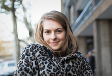 Portrait Confident Young Woman In Leopard Print Coat