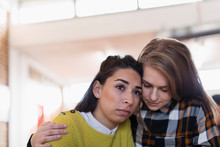 Young Woman Consoling Friend