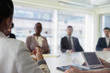 © Tom Merton/Caia Image - Business people talking in conference room meeting