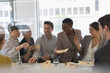 © Tom Merton/Caia Image - Happy business people enjoying sushi lunch