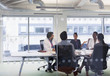 © Tom Merton/Caia Image - Doctors and administrators talking in conference room meeting