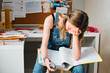 © Paul Viant/Caia Image - Tired, stressed female college student studying