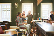 © Trevor Adeline/Caia Image - Male barbers and customers in barbershop