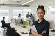 © Tom Merton/Caia Image - Portrait confident businesswoman with digital tablet in open plan office