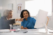 © Tom Merton/Caia Image - Female doctor and patient using computer in doctors office