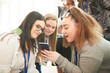 © Himalayan Pics/Caia Image - High school girl friends using smart phone