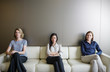© Martin Barraud/Caia Image - Portrait serious businesswomen waiting on sofa