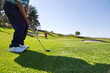 © Trevor Adeline/Caia Image - Male golfer taking a shot on sunny golf course