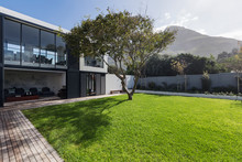 Sunny Home Showcase Exterior Lawn And Tree Below Mountain
