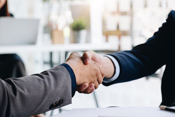 Business partnership meeting concept. Image businessmans handshake. Successful businessmen handshaking after good deal.