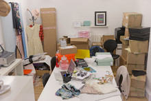 Clothing and boxes in messy fashion buyers office