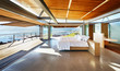 © Chris Ryan/Caia Image - Modern luxury home showcase bed open to patio with sunny ocean view