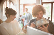 © Justin Pumfrey/Caia Image - Young couple looking into pot at refrigerator