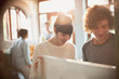 © Justin Pumfrey/Caia Image - Young couple opening refrigerator in kitchen