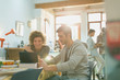 © Justin Pumfrey/Caia Image - Young men college students studying with laptop at table